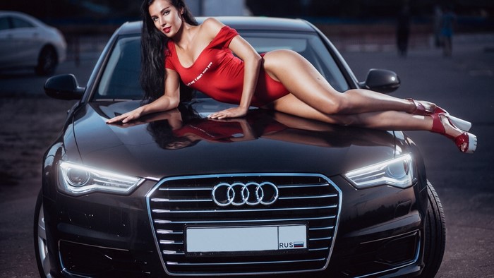Yulia Chekanova posing on an Audi car