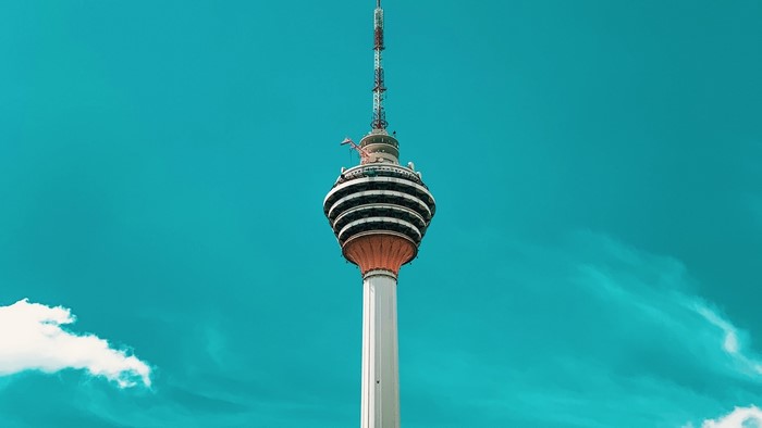 KL Tower against a bright blue sky