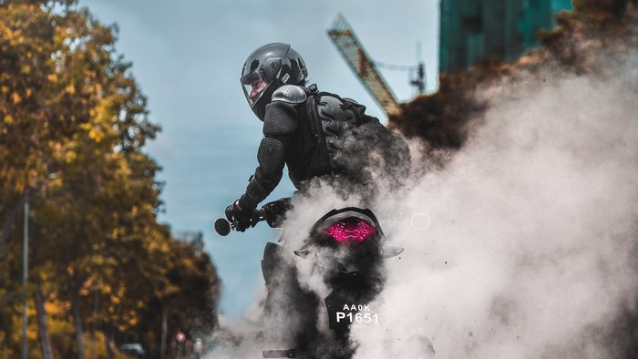 Biker performing a burnout with smoke