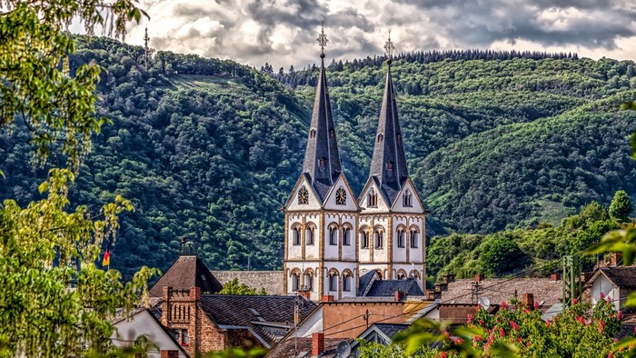 Church towers in a German village with forested hills
