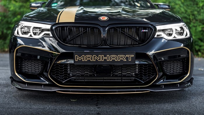 Black Manhart BMW M5 with gold accents