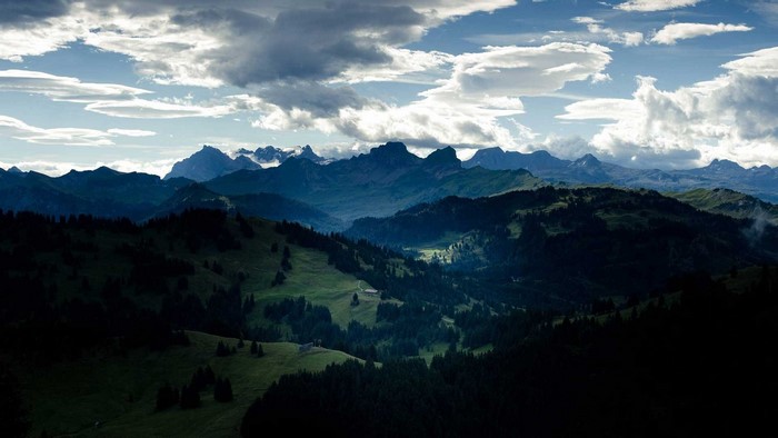 Mountain range under a cloudy sky