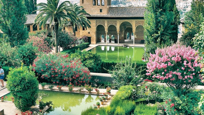 Alhambra gardens with reflecting pools and architecture