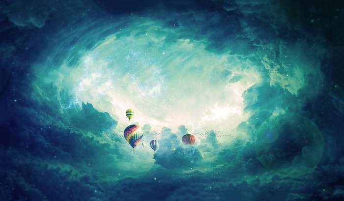 Hot air balloons in a cloudy sky
