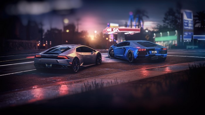 Two Lamborghinis on a wet street at night