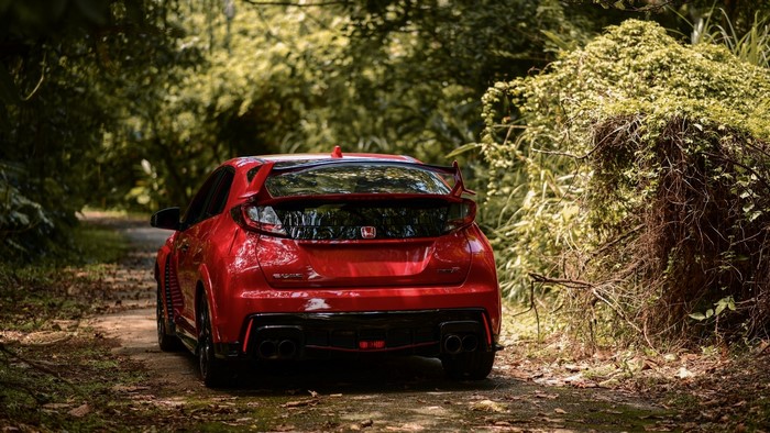 Red Honda Civic Type R FK2 on a dirt road