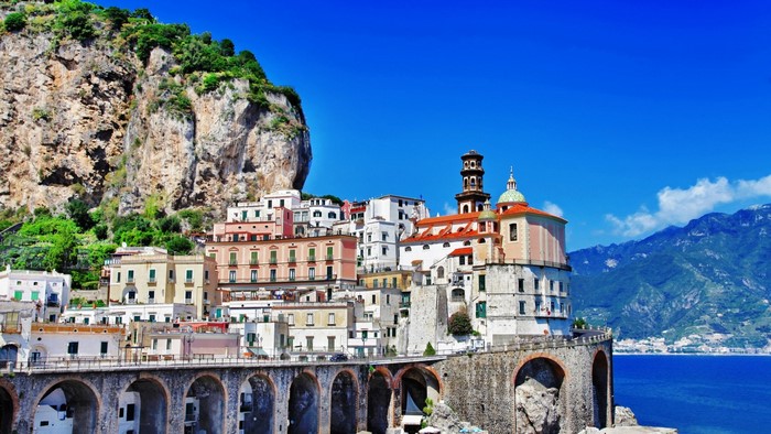 Amalfi Coast town with cliffside buildings and the sea