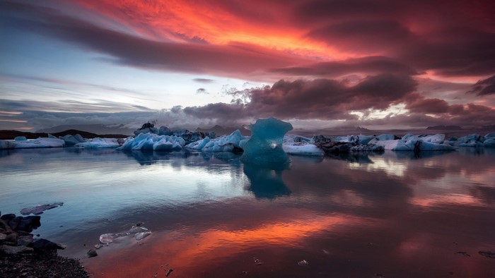 Icebergs floating in a lake during sunset in Iceland