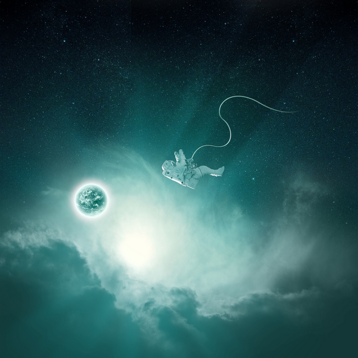 Astronaut floating in space near a glowing planet