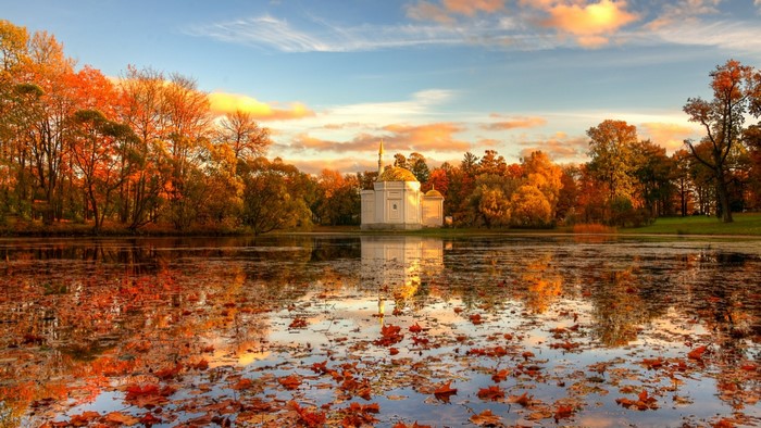 Autumn lake with a building and trees