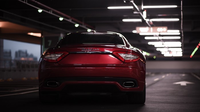Red Maserati GranTurismo in parking garage