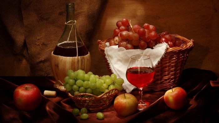 Still life with wine bottle, grapes, apples, and wine glass