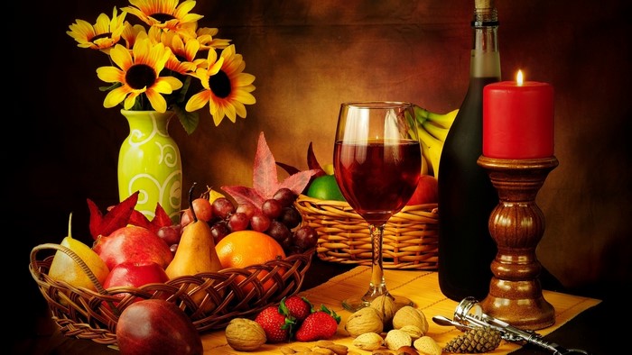Still life with fruit, wine, and sunflowers