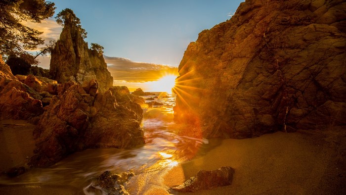Sunset over Costa Brava rocky coastline