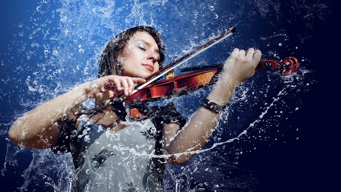 Girl playing violin in water