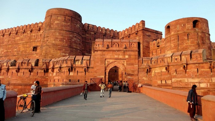 Agra Fort entrance with people and bicycle