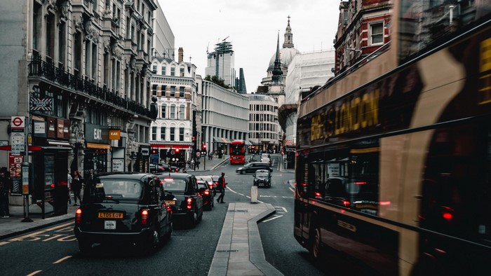 London street with double-decker bus and black cabs