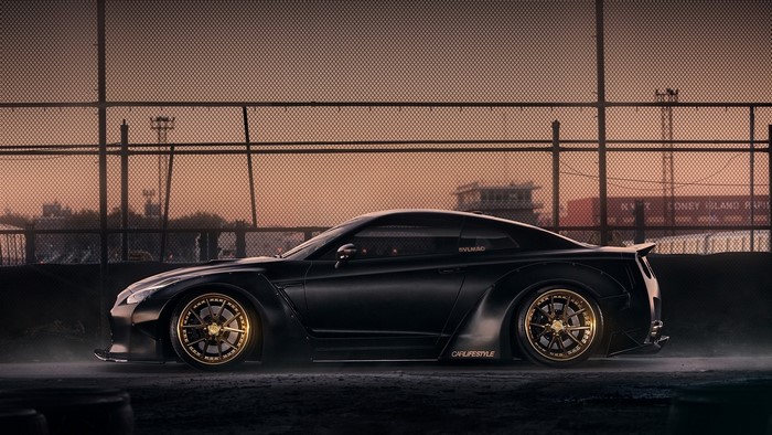 Black Nissan GTR with gold rims
