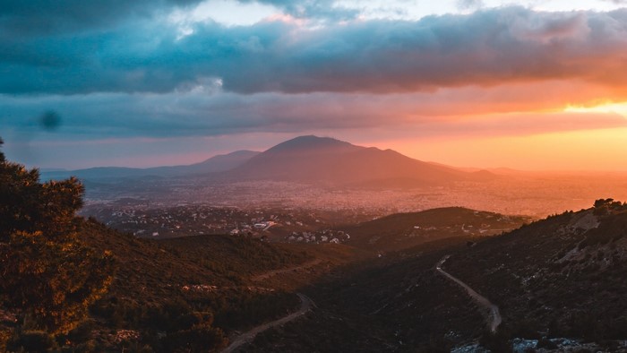 Sunset over mountains and city
