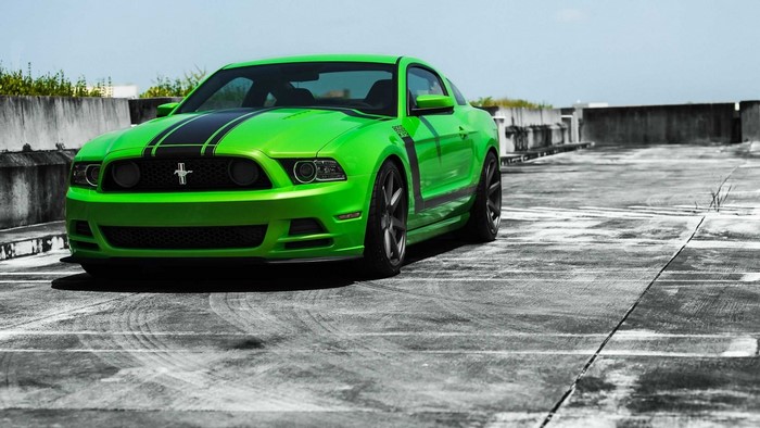 Green Ford Mustang Boss 302 on rooftop