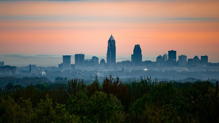 City Skyline at Sunrise with Fog