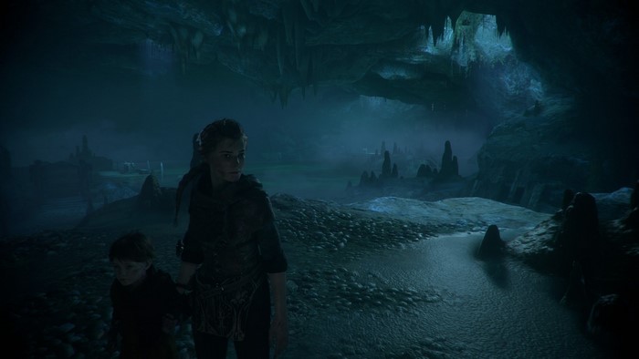 Amicia and Hugo from A Plague Tale in a cave