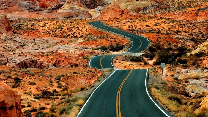 Winding road through desert landscape