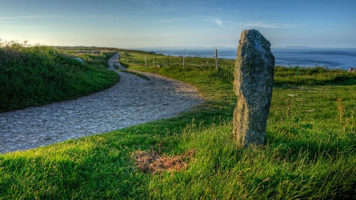 Stone along a cobblestone road by the sea
