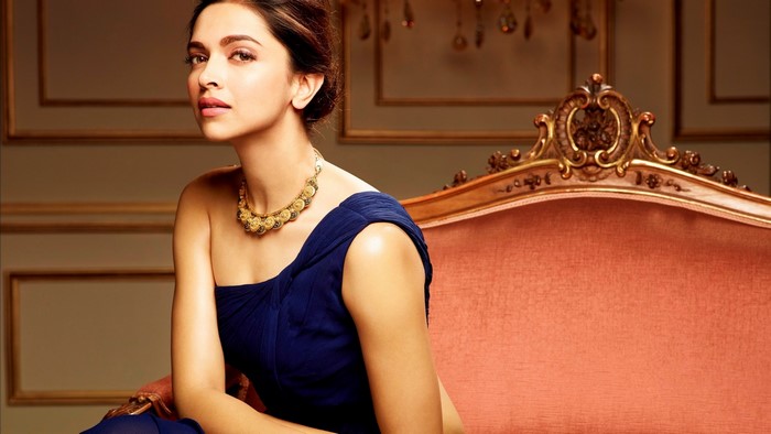 Deepika Padukone in a blue dress with a necklace
