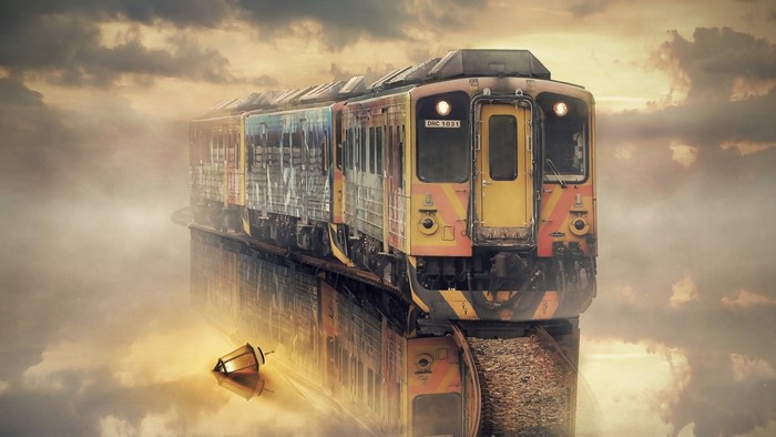 Train reflected in water with clouds