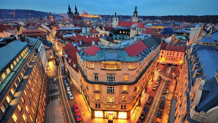 Prague cityscape at dusk with historic architecture