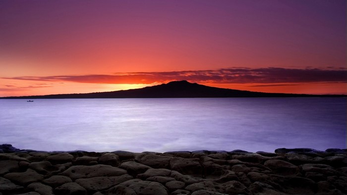 Rangitoto Island at sunset over the ocean