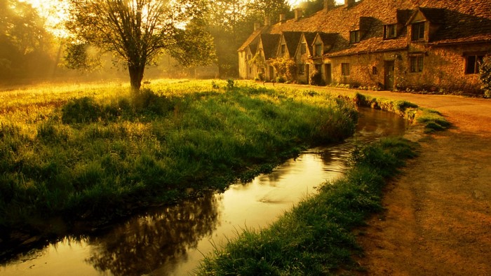 Cotswold village with stream and cottages