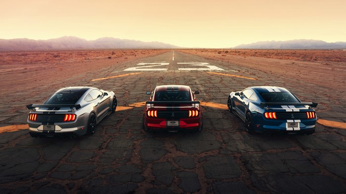 Three Ford Mustang Shelby GT500s on a Desert Road