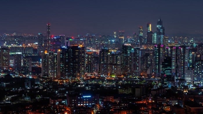 Night cityscape with illuminated skyscrapers