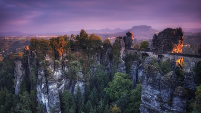 Bastei Bridge over sandstone rocks at sunset