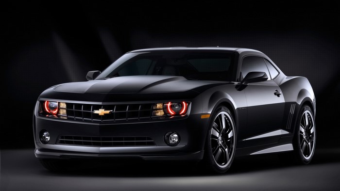 Black Chevrolet Camaro with red halo headlights