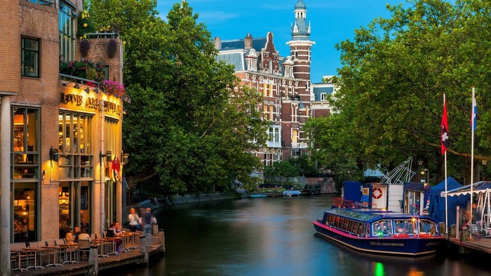 Amsterdam Canal with Boat and Buildings