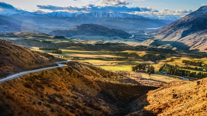 Winding road through rolling hills and mountains