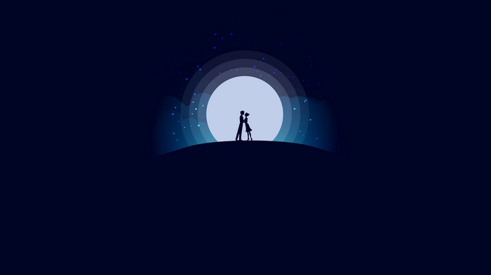 Couple embracing under a large full moon at night