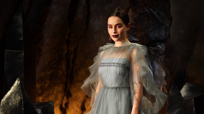 Emilia Clarke in a grey dress