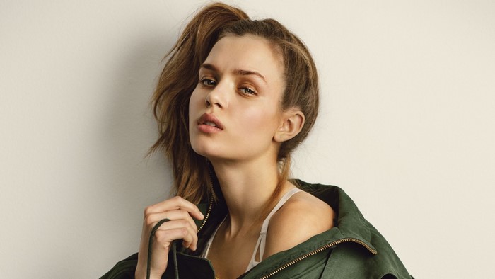 Josephine Skriver wearing a green jacket
