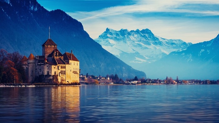 Chillon Castle on Lake Geneva with Alps