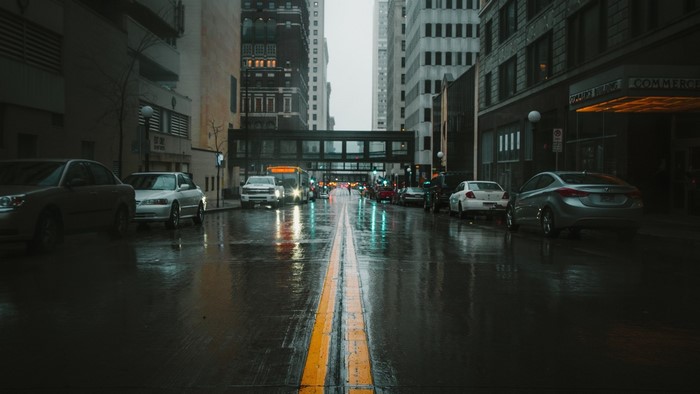 Street scene with cars on a rainy day