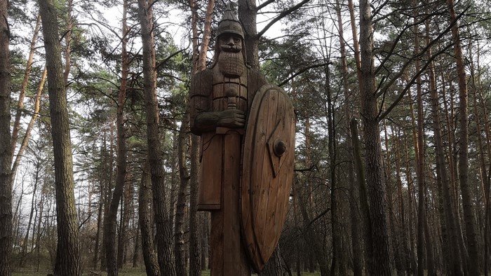 4K Wooden Bogatyr Statue in Forest