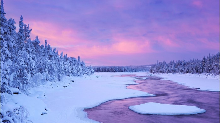 Winter river and forest at sunset