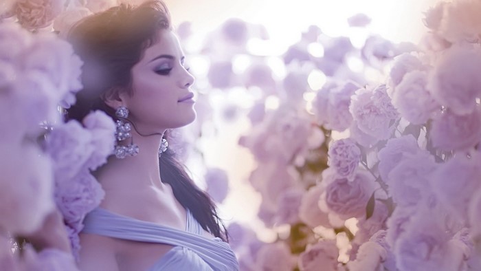 Selena Gomez among pink flowers
