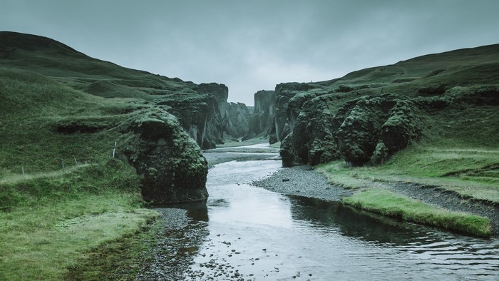 River flowing through a mossy canyon