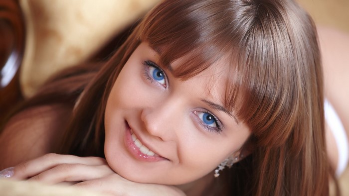 Smiling young woman with blue eyes