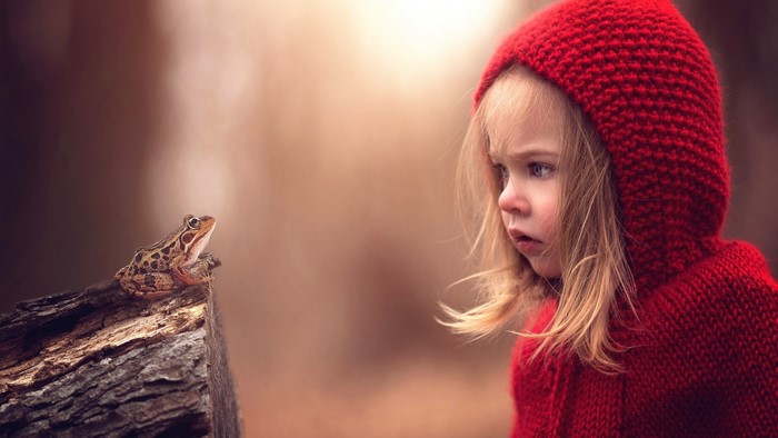 Girl in red hood meets a frog